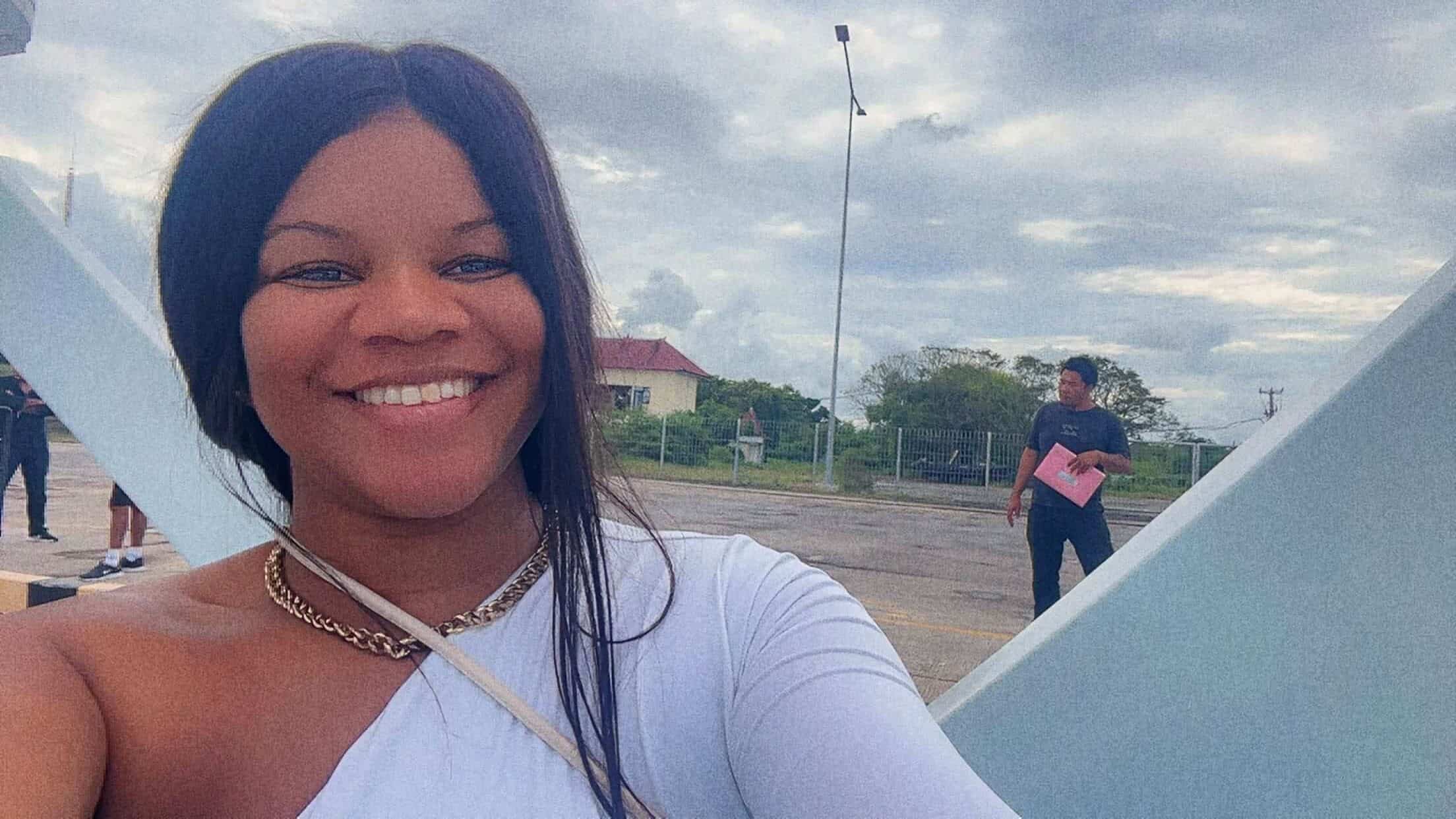 Marisa Fortes, founder of The Money Brag financial freedom blog, smiling while traveling